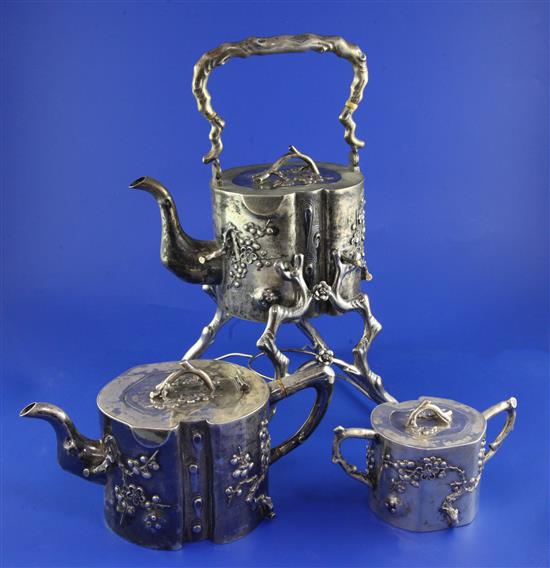 A late 19th/early 20th century Chinese export silver three piece tea set by Hung Chong & Co, Shanghai, gross 65 oz.